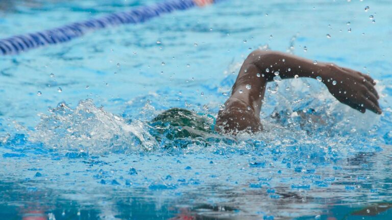 A swimmer swimming in the swimming pool